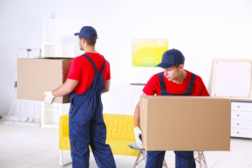 Removal team planning a move in an Earls Court residential street
