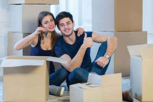 Man and van team carefully handling furniture during a safe move
