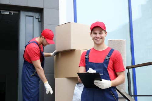 House movers loading furniture in Earls Court on a residential street