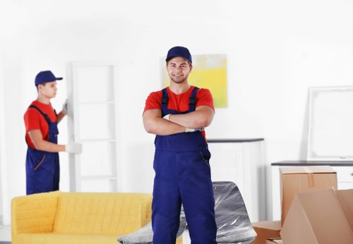 Professional movers handling furniture for a local property move