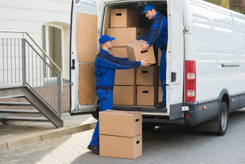 Moving team helping with house removals in Earls Court street setting