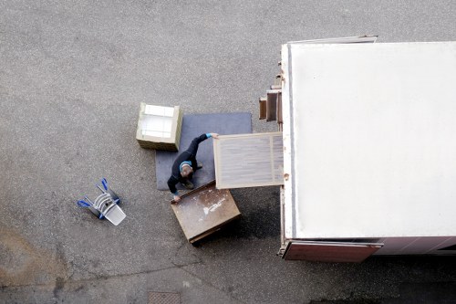 Local moving team handling boxes and furniture in Earls Court