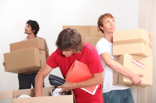 Packing boxes and furniture ready for a truck hire move