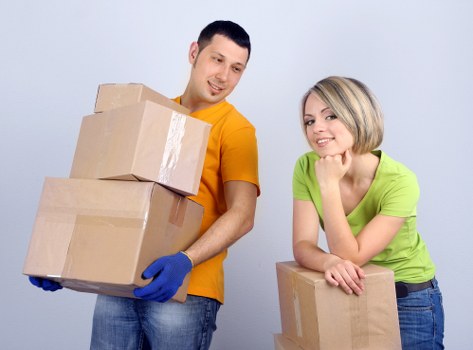 Staff member demonstrating careful handling in a moving job