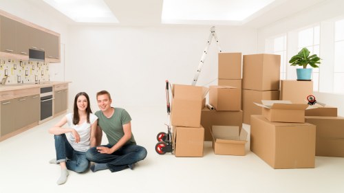 Packed moving boxes and furniture ready for removals van transport in Earls Court