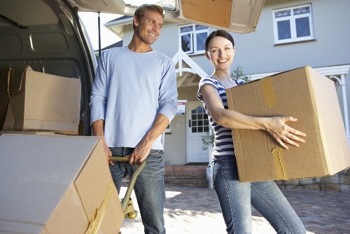 Unpacking boxes and setting up rooms after a move in West London