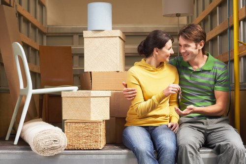 Furniture and boxes being arranged in a removal van